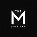The M Jewelers logo